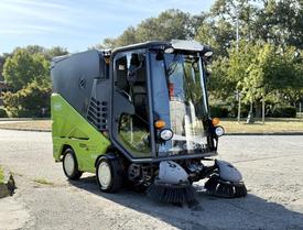 2015 Tennant 636 Green Machine street sweeper with a compact design dual front brushes and a large clear cab for visibility