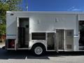 2009 Morgan Olson Workhorse with open compartments on the side revealing shelves and storage space