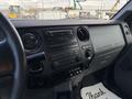 Interior dashboard of a 2016 Ford F-750 featuring a standard radio and controls with the text Super Duty displayed on the panel