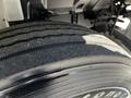 Close-up of a tire on a 2021 Hino 338 showing tread pattern and sidewall details