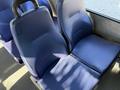Two blue fabric seats in a 2019 Chevrolet Express with textured upholstery and a sturdy design