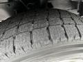 Close-up of a tire from a 2017 Ford Transit 350 showcasing its tread pattern and rubber surface