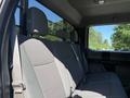 Interior of a 2017 Ford F-350 SD showing a spacious back seat with gray upholstery and headrests
