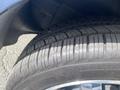 A close-up of a 2007 Chrysler PT Cruiser tire showing detailed tread patterns and a shiny rim