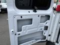 A disassembled door panel of a 2012 Chevrolet Express showing the inner structure without any exterior covering