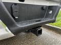 Close-up of the hitch receiver on a 2017 Ford F-150 with water droplets on the surface