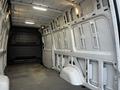 Interior of a 2019 Mercedes-Benz Sprinter van showcasing the empty cargo space with metal walls and a gray floor