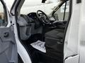 Interior view of a 2017 Ford Transit showing the driver's seat steering wheel and dashboard with controls