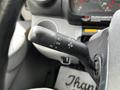 Close-up of the gearshift lever of a 2018 Hino 195 showing controls for lights and turn signals
