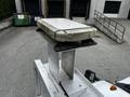 2011 Ford F-550 emergency vehicle light mounted on a silver platform with a flat top