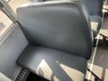 Interior view of a blue seat in a 2007 Blue Bird Vision school bus