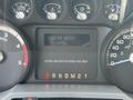 Dashboard of a 2011 Ford F-350 SD displaying engine hours with a reading of 6852 and gauges for turbo pressure and fuel levels