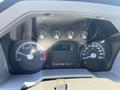 Dashboard of a 2015 Ford F-450 SD displaying trip information speedometer tachometer and fuel gauge