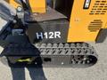 A 2024 AGT Mini Excavator with a yellow and black design featuring a track system and a labeled side panel displaying H12R