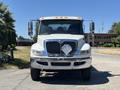 A 2018 International DuraStar truck with a silver front grille and bright headlights is facing forward