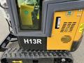 A yellow and black 2024 AGT Industrial H13R Mini Excavator with a visible label and a window showing the operator's cabin