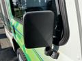 Close-up of the side mirror of a 2019 CanEV Might-E Truck highlighting its rectangular shape and textured surface