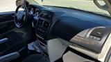 Interior view of a 2016 Dodge Grand Caravan showcasing the dashboard steering wheel and center console