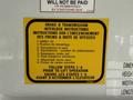 2010 Ford Econoline with a yellow instruction label regarding brake and transmission interlock instructions