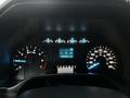 The dashboard of a 2016 Ford F-150 showing gauges for speed fuel and odometer with a digital display indicating 2090903 km