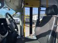 Interior view of a 2017 Chevrolet Express showing the driver's seat and dashboard with steering wheel and controls