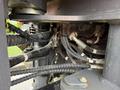 Close-up view of the hydraulic components and hoses of a 2018 Doosan DL300-5 showing intricate connections and machinery details