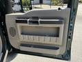 The image shows the interior door panel of a 2008 Ford F-550 featuring a large storage compartment and a speaker grille