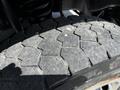 Close-up of the tread on a 2009 Ford F-550 tire showing wear and the distinct pattern of the rubber surface