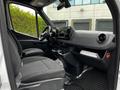Interior view of a 2020 Mercedes-Benz Sprinter showing driver and passenger seats dashboard and console with controls and storage compartments