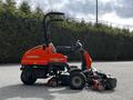 A red 2015 Jacobsen Eclipse 322 lawn mower with a high handle and multiple cutting decks visible in the front