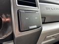 A close-up view of the dashboard of a 2017 Ford F-250 SD showing a compartment with two 12V power outlet covers