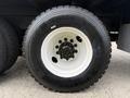 Close-up of a black tire mounted on a white wheel with metal bolts, featuring the brand name Euroring and the tire size 215/75R 17.5
