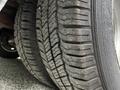 Close-up view of two worn tires from a 2019 Chevrolet Express showing distinct tread patterns and varying levels of wear on the rubber surface