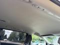 Interior view of a 2014 Honda Odyssey showing the ceiling with lights and overhead controls