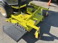 A yellow 2010 Kubota F3990 lawn mower attachment with multiple cutting blades and wheels for maneuverability
