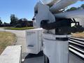A 2016 Ford F-550 vehicle equipped with a bucket truck mechanism for reaching elevated areas