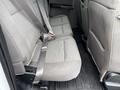The back seats of a 2018 Ford F-150 with gray fabric upholstery and seatbelts visible on each seat