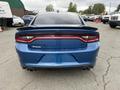 A blue 2022 Dodge Charger GT viewed from the rear showcasing its sleek design and distinctive taillights