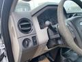 Interior view of a 2009 Ford F-450 SD showing the dashboard with air vents a gear shift and various controls