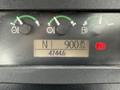 Instrument panel of a 2011 John Deere 310SJ 4x4 Wheel Loader showing gauges for engine RPM fuel and other indicators with a digital display showing 900 RPM and 4744.6 hours