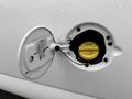 Close-up of the fuel filler cap of a 2014 GMC Savana with water droplets on the surface