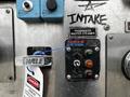 Close-up of control panel with labels and buttons for a 2009 Spartan Gladiator including a prime handle and intake valve controls in various colors