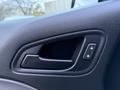 A black interior door handle with a lock button for a Chevrolet Colorado