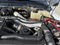2015 Ford F-550 engine with visible components including hoses coolant reservoir and air intake system