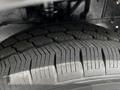A close-up of a tire showcasing its tread pattern and rubber texture on a 2022 Ford Transit