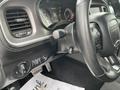 Interior view of a 2022 Dodge Charger featuring the steering wheel controls and dashboard display showcasing speedometer and other metrics