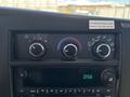 Dashboard controls of a 2020 Chevrolet Express showing temperature and airflow settings along with a digital clock display