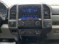 Dashboard of a 2020 Ford F-350 featuring a touchscreen display climate controls and various buttons for media and settings