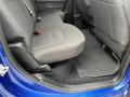 Interior view of the back seat area of a 2019 RAM 1500 Classic featuring black fabric upholstery and floor mats