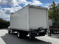 A white 2020 Hino 338 box truck viewed from the rear with a smooth exterior and no visible markings or logos